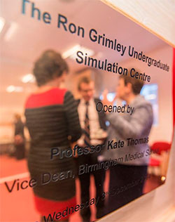 Mr Atiq Rehman and Professor Kate Thomas opening the plaque for the simulation centre